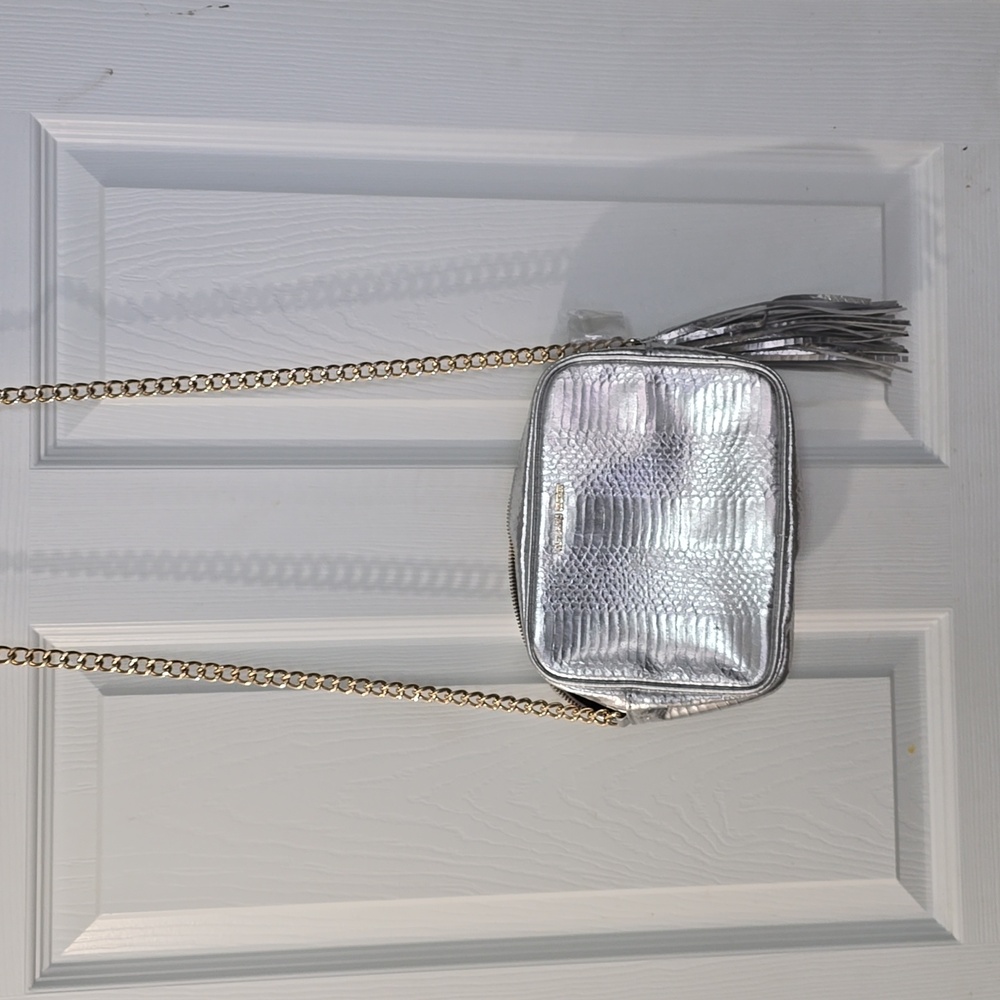 Victoria's Secret Silver crossbody purse‎ with gold chain strap and tassel